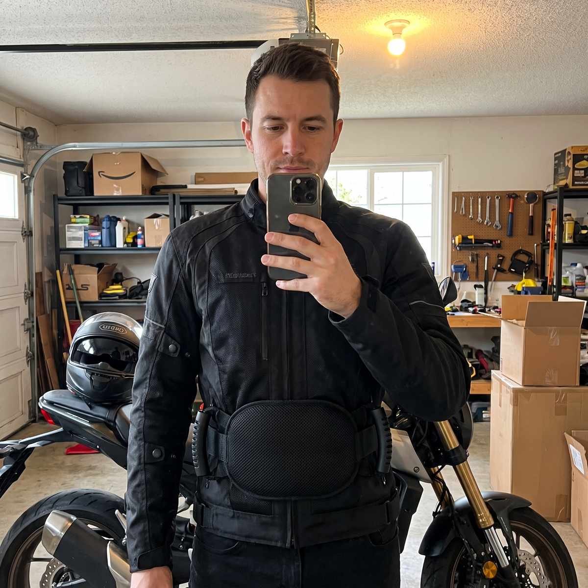 Rider wearing the RideGrip Belt in his garage